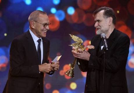 MOSCOW REGION, RUSSIA â€“ APRIL 1, 2018: Film director Andrei Konchalovsky (L) looks on as producer Sergei Selyanov accepts the Best Film award for Boris Khlebnikov s film Arrhythmia at the 31st Nika Film Award Ceremony, at the Vegas City Hall. Vyacheslav Prokofyev TASS  TS07A36A