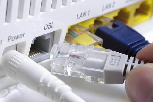 A network cable is inserted in a router in the connection for DSL Digital Subscriber Line Berlin 05 04 2018 Berlin Germany Copyright: xThomasxTrutschel photothek.netx