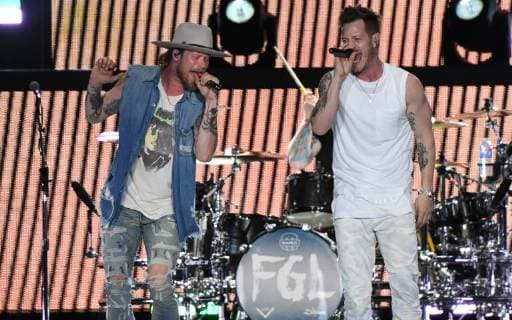 April 6, 2018 - Fort Lauderdale, FL, USA - Tyler Hubbard, right, and Brian Kelley of Florida Georgia Line perform at the Tortuga Music Festival in Fort Lauderdale, Fla., on Friday, April 6, 2018. Fort Lauderdale USA - ZUMAm67_ 20180406_zaf_m67_160 Copyright: xJimxRassolx
