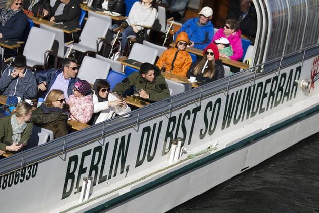 People enjoy the sunny day on a passenger ship on the river Spree in Berlin on 6 April 2018. Sunny spring day in Berlin