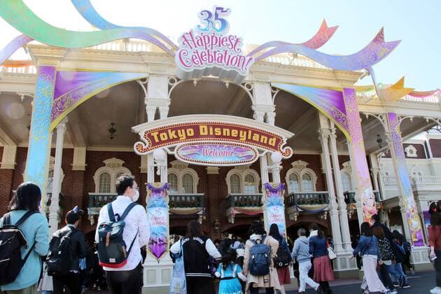April 10, 2018, Urayasu, Japan - Guests enter the Tokyo Disneyland in Urayasu, suburban Tokyo durng a press preview for the park s 35th anniversary event on Tuesday, April 10, 2018. Tokyo Disneyland will celebrate its 35th anniversary on April 15 and the new attractions of the Happiest Celebration will be held for a year.  (75850996)