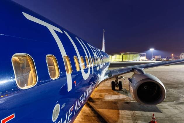 TUIfly Boeing 737 Airplane Stuttgart Airport special painting night picture Stuttgart Germany 28 February 2018 A Boeing 737 800 of the TUIfly with the registration D ATUD and the special painting TUI Blue at the airport Stuttgart STR in Germany