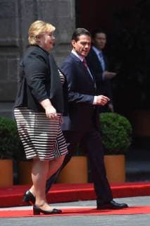 April 12, 2018 - Mexico City, Mexico - Mexican President Enrique Pena Nieto (R) and Norwegian prime Minister Erna Solberg, talk during her welcome ceremony at the National Palace in Mexico City on April 12, 2018. Mexico City Mexico  - ZUMAn230 20180412_zaa_n230_850 Copyright: xCarlosxTischlerx