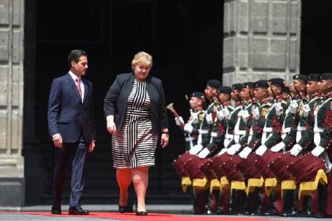 April 12, 2018 - Mexico City, Mexico - Mexican President Enrique Pena Nieto (R) and Norwegian prime Minister Erna Solberg, talk during her welcome ceremony at the National Palace in Mexico City on April 12, 2018. Mexico City Mexico  - ZUMAn230 20180412_zaa_n230_848 Copyright: xCarlosxTischlerx