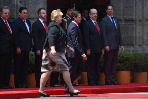 April 12, 2018 - Mexico City, Mexico - Mexican President Enrique Pena Nieto (R) and Norwegian prime Minister Erna Solberg, talk during her welcome ceremony at the National Palace in Mexico City on April 12, 2018. Mexico City Mexico  - ZUMAn230 20180412_zaa_n230_851 Copyright: xCarlosxTischlerx