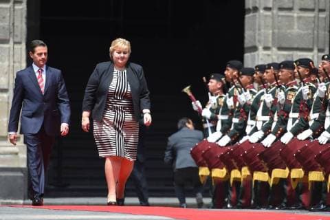 April 12, 2018 - Mexico City, Mexico - Mexican President Enrique Pena Nieto (R) and Norwegian prime Minister Erna Solberg, talk during her welcome ceremony at the National Palace in Mexico City on April 12, 2018. Mexico City Mexico  - ZUMAn230 20180412_zaa_n230_849 Copyright: xCarlosxTischlerx