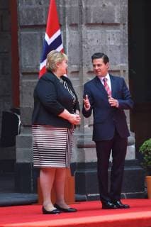April 12, 2018 - Mexico City, Mexico - Mexican President Enrique Pena Nieto (R) and Norwegian prime Minister Erna Solberg, talk during her welcome ceremony at the National Palace in Mexico City on April 12, 2018. Mexico City Mexico  - ZUMAn230 20180412_zaa_n230_852 Copyright: xCarlosxTischlerx
