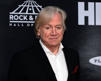 Justin Hayward of the Moody Blues poses for a photo on the red carpet at the 33rd annual Rock and Roll Hall of Fame induction ceremonies at Public Hall on April 14, 2018 in Cleveland Ohio. Bon Jovi, the Cars and four first-time nominees, including Nina Simone, will be inducted Saturday night as the 2018 Rock & Roll Hall of Fame class.  CLE201804145093 SCOTTxMCKINNEY