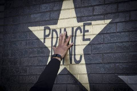 April 21, 2017 - Minneapolis, MN, USA - United States - Many fans touched the Prince star on the exterior of the building at First Avenue to remember him on the first anniversary of his death, Friday, April 21, 2017 in Minneapolis, MN. ELIZABETH FLORES ¢ liz.flores@startribune.com Minneapolis USA - United States - ZUMAm42_ 20170421_zaf_m42_023 Copyright: xElizabethxFloresx