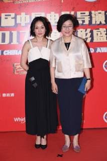 Chinese actress Zhou Xun, left, and film and television director Li Shaohong pose as they arrive on the red carpet for 9th China Film Directors Guild Award in Beijing, China, 21 April 2018. Zhao Wei, Zhou Xun dress up for 9th China Film Directors Guild Award in Beijing  pbu789351_49