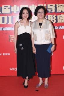 Chinese actress Zhou Xun, left, and film and television director Li Shaohong pose as they arrive on the red carpet for 9th China Film Directors Guild Award in Beijing, China, 21 April 2018. Zhao Wei, Zhou Xun dress up for 9th China Film Directors Guild Award in Beijing  pbu789357_01