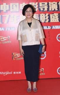 Chinese film and television director Li Shaohong poses as she arrives on the red carpet for 9th China Film Directors Guild Award in Beijing, China, 21 April 2018. Zhao Wei, Zhou Xun dress up for 9th China Film Directors Guild Award in Beijing  pbu789357_09