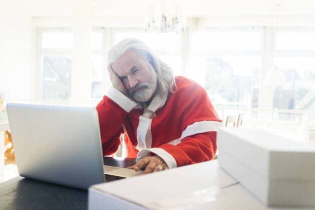 Frustrated Santa using laptop at home model released Symbolfoto property released  MOEF01003