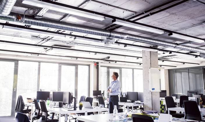 Mature businessman standing in open plan office model released Symbolfoto property released  HAPF02693