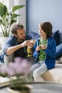 Father and son carving together at home model released Symbolfoto property released  KNSF03592
