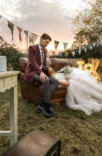 Bride lying over sofa with groom in the field model released Symbolfoto property released  DAPF00928