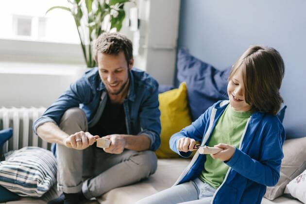 Father and son carving together at home model released Symbolfoto property released  KNSF03593