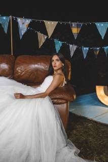 Serious bride lying on sofa on a night field party model released Symbolfoto property released  DAPF00957