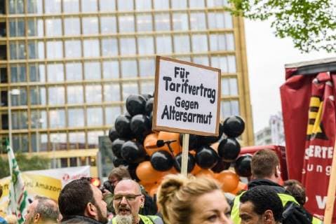 Protest against the presentation of the Axel Springer Award On 24 April 2018, hundreds of employees and sympathizers demonstrated in Berlin against the awarding of the Axel Springer Award to Amazon boss Jeff Bezos. In the afternoon, several hundred participants gathered at Oranienplatz in Kreuzberg to visit nearby Axel Springer skyscraper to pull Berlin Berlin Germany Kreuzberg Mitte