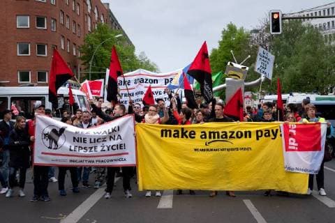 Protest Amazon Hundreds of people protest on the occasion of the award of the Amazon founder Jeff Bezos for his visionary entrepreneurship with the Axel Springer Award 2018 Under the motto No price for exploitation Amazin employees from Germany Spain and Poland move to the Axel Apringer skyscraper against the online working cond