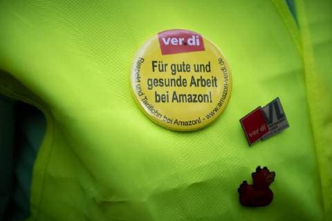 Protest Amazon Hundreds of people protest on the occasion of the award of the Amazon founder Jeff Bezos for his visionary entrepreneurship with the Axel Springer Award 2018 Under the motto No price for exploitation Amazin employees from Germany Spain and Poland move to the Axel Apringer skyscraper against the online working