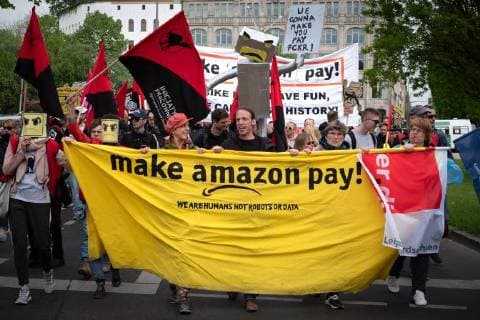 Protest Amazon Hundreds of people protest on the occasion of the award of the Amazon founder Jeff Bezos for his visionary entrepreneurship with the Axel Springer Award 2018 Under the motto No price for exploitation Amazin employees from Germany Spain and Poland move to the Axel Apringer skyscraper against the online working cond