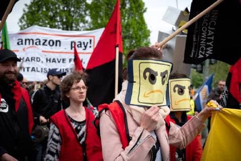 Protest Amazon Hundreds of people protest on the occasion of the award of the Amazon founder Jeff Bezos for his visionary entrepreneurship with the Axel Springer Award 2018 Under the motto No price for exploitation Amazin employees from Germany Spain and Poland move to the Axel Apringer skyscraper against the online working conditions Mail order company Amazon and to pro