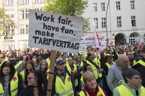Amazon employees protesting against the presentation of the Axel Springer Award to Amazon boss Jeff Bezos in front of the Axel Springer publishing house in Berlin Employees protest against the presentation of the Axel Springer Award to Amazon boss Bezos