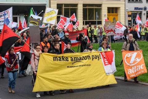 Amazon employees protesting against the awarding of the Axel Springer Award to Amazon boss Jeff Bezos in front of the Axel Springer publishing house in Berlin snapshot photography F Boillot