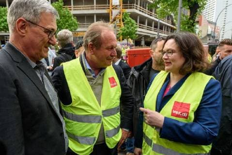 Party Chairman Bernd Riexinger The Left Frank Bsirske Chairman Verdi and party leader Andrea Nahles SPD during a protest action by the United Services Union ver di against the presentation of the Axel Springer Award to Amazon boss Jeff Bezos in front of the Axel Springer publishing house in Berlin snapshot photography F Boillot