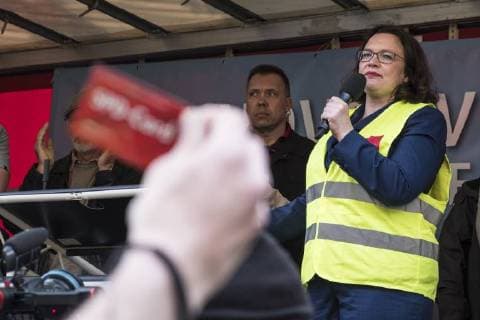 Party leader Andrea Nahles SPD speaks to Amazon employees during a protest action by the United Services Union ver di against the award of the Axel Springer Award to Amazon boss Jeff Bezos in front of Axel Springer Verlag in Berlin Employees protest against the presentation of the Axel Springer Award to Amazon boss Bezos