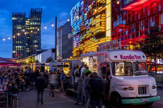 Food truck festival at the Spielbudenplatz near Reeperbahn at dusk, Hamburg, Germany, Europe Copyright: OliverxWintzen 1283-89 Editorial Use Only