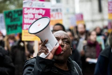April 28, 2018 - London, United Kingdom - A protester seen giving a speech through a speaker during the march..The Windrush generation solidarity protest gathered around 200 people at the Churchill Statue in Parliament Square to show disgust at the government s treatment of those from the Windrush generation. Despite the government s recent actions to attempt to rectify it, this never should have happened in the first place , they say. London United Kingdom - ZUMAs197 20180428_zaa_s197_047 Copyright: xBraisxG.xRoucox