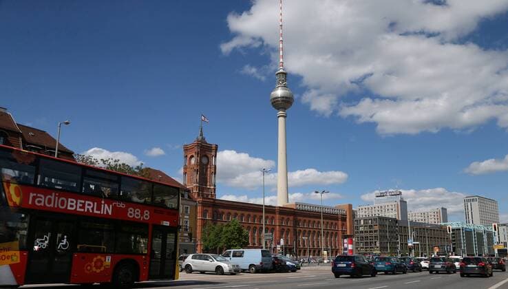 Red Town Hall TV Tower Park Inn 01 05 18 Red Town Hall and TV Tower Berlin GER Image Traffic on Gruner Street in front of the Red Town Hall TV Tower and Hotel Park Inn on Alexanderplatz at daytime with blue sky Berlin Berlin Germany Mitte