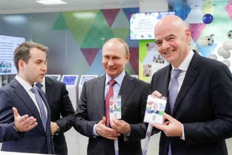 SOCHI, RUSSIA â€“ MAY 3, 2018: FIFA President Gianni Infantino, Russia s President Vladimir Putin, and Russia s Communications and Mass Media Minister Nikolai Nikiforov (R-L) visit a 2018 FIFA World Cup Fan ID distribution centre. Mikhail Metzel TASS  TS07DEA1