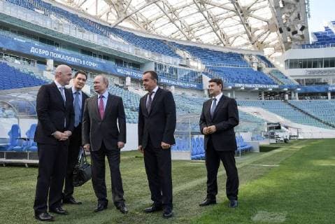 SOCHI, RUSSIA â€“ MAY 3, 2018: Russian President Vladimir Putin s aide Igor Levitin, Krasnodar Territory Governor Veniamin Kondratyev, Russia s President Vladimir Putin, and President Gianni Infantino (R-L) inspect Fisht Stadium, a venue for 2018 FIFA World Cup matches. Alexei Nikolsky Russian Presidential Press and Information Office TASS  TS07DED9