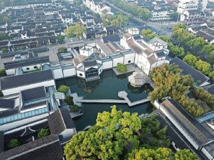 China: Suzhou Museum Suzhou Museum is located in Gusu District, Suzhou,east China s Jiangsu Province.The museum was designed by the world-famous Chinese-American architect I. M. Pei and opened to visitors in October 2006. This museum has abundant porcelains, relics of the revolution, most notably celadon, handicraft works, calligraphies and paintings of Ming and Qing Dynasties (1368-1911) which fully embody the history, art, and culture of Suzhou and Yangtze River Delta. Suzhou Museum obeys the theme of Design for China . It combines modern exhibition halls and classical gardens architecture together. CHINA OUT Suzhou Suzhou China  YuexZhiqiang