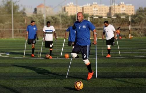 May 7, 2018 - Deir Al-Balah, Gaza Strip, Palestinian Territory - Disabled Palestinians who were lost their limbs during the Israeli wars on Gaza Strip participate in football training, in Deir al-Balah in the center of Gaza Strip on May 7, 2018 Deir Al-Balah Palestinian Territory - ZUMAap3_ 20180507_zaf_ap3_100 Copyright: xAshrafxAmrax