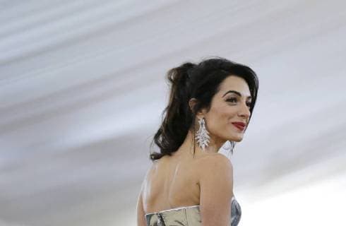 Amal Clooney arrives on the red carpet at The Metropolitan Museum of Art s Costume Institute Benefit Heavenly Bodies: Fashion and the Catholic Imagination at Metropolitan Museum of Art in New York City on May 7, 2018.  NYP20180507821 JOHNxANGELILLO