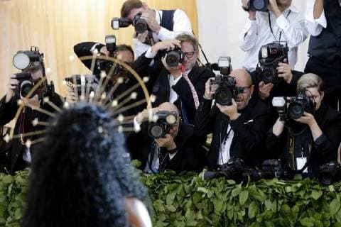 Photographers take pictures of SZA when she arrives on the red carpet at The Metropolitan Museum of Art s Costume Institute Benefit Heavenly Bodies: Fashion and the Catholic Imagination at Metropolitan Museum of Art in New York City on May 7, 2018.  NYP20180507833 JOHNxANGELILLO