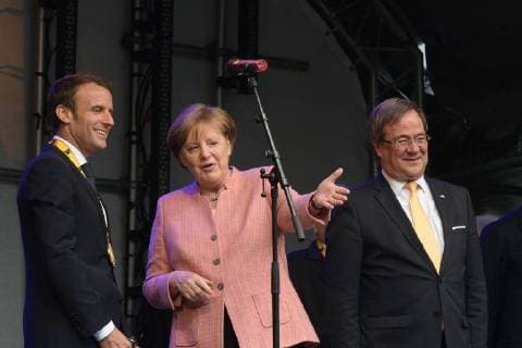 Presentation of the Charlemagne Prize 2018 to Emmanuel Macron The picture shows French President Emmanuel Macron the German Chancellor Angela Merkel Prime Minister Armin Laschet 2018 Awarding of the Karlspreis 2018 to Emmanuel Macron