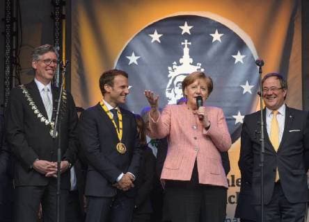 Presentation of the Charlemagne Prize 2018 to Emmanuel Macron The picture shows French President Emmanuel the German Chancellor Angela Merkel Prime Minister Armin Laschet 2018 Awarding of the Karlspreis 2018 to Emmanuel Macron