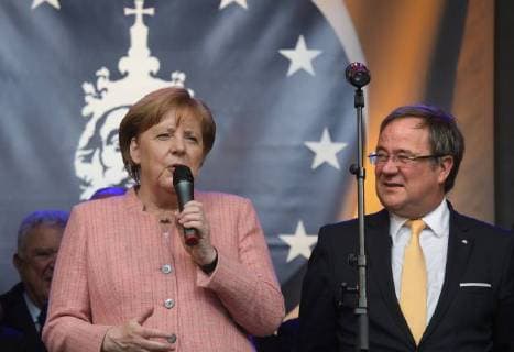 Presentation of the Charlemagne Prize 2018 to Emmanuel Macron The picture shows the German Chancellor Angela Merkel with the Prime Minister of the German Federal State North Rhine Westphalia Armin Laschet 2018 Presentation of the Charlemagne Prize 2018 to Emmanuel Macron
