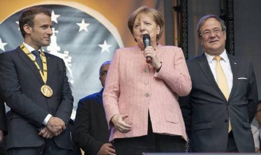 French President Emmanuel Macron has been honored with the International Charlemagne Prize at Aachen In the circle of heads of state and government and former Charlemagne Prize winners, the French President was honored in the Coronation Hall in Aachen. Photo MP Armin Laschet Angela Merkel Chancellor Aachen Coronation Hall NRW Germany