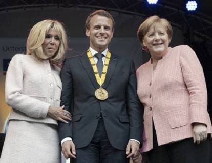 French President Emmanuel Macron has been honored with the International Charlemagne Prize at Aachen In the circle of heads of state and government and former Charlemagne Prize winners, the French President was honored in the Coronation Hall in Aachen Photo Brigitte and Emmanuel Macron Angela Merkel Chancellor Aachen Coronation Hall NRW Germany