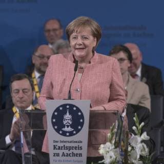 French President Emmanuel Macron has been honored with the International Charlemagne Prize at Aachen In the circle of heads of state and government and former Charlemagne Prize winners, the French President was honored in the Coronation Hall in Aachen. Photo Angela Merkel Chancellor Aachen Coronation Hall NRW Germany