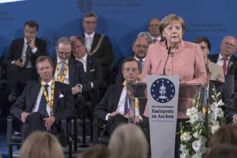 French President Emmanuel Macron has been honored with the International Charlemagne Prize at Aachen In the circle of heads of state and government and former Charlemagne Prize winners, the French President was honored in the Coronation Hall in Aachen. Photo Angela Merkel Chancellor Aachen Coronation Hall NRW Germany