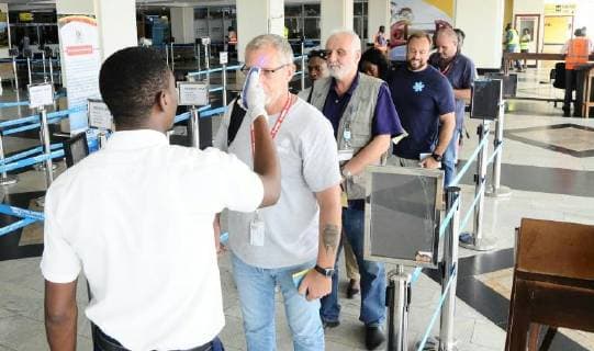(180516) -- KAMPALA, May 16, 2018 -- Passengers queue to be screened at Uganda s Entebbe International Airport on May 15, 2018. Medical officers have been deployed at the airport to screen all passengers coming into the country, especially those from neighboring Democratic Republic of the Congo (DRC) where there is an Ebola outbreak. ) (yy) UGANDA-KAMPALA-EBOLA-AIRPORT-SCREENING JosephxKiggundu 