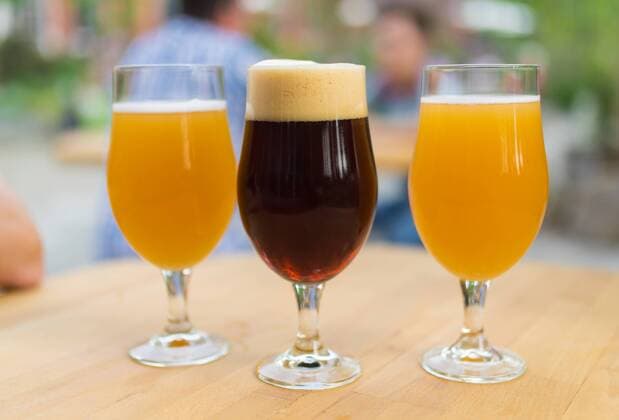 10 05 2018 Berlin Germany GER Close up of filled beer glasses The goblets are filled with a wheat beer and a dark beer from a Berlin craft beer brewery