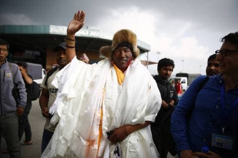 May 20, 2018 - Kathmandu, Nepal - Nepalese veteran mountaineer Kami Rita Sherpa, 48, who broke the world record after climbing the world s highest mountain Mount Everest for the 22nd time, waves to the media upon his arrival from Everest base camp at Kathmandu airport in Nepal on Sunday, May 20, 2018. Kathmandu Nepal - ZUMAg200 20180520_zap_g200_002 Copyright: xSkandaxGautamx